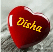 a red heart with the name disha on it