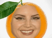 a woman with an orange on her head and a green leaf on it