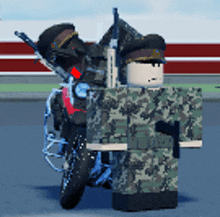 a toy soldier is standing next to a motorcycle with a gun on the back