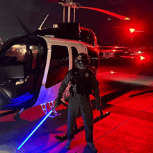 a man holding a light saber in front of a helicopter with the number 505