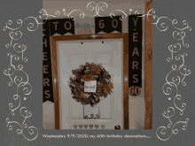 a picture of a 60th birthday decoration with a wreath on the door