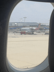 an american airlines plane is parked on the tarmac at an airport