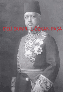 a black and white photo of a man with the name deli dumrul ozkan pasa