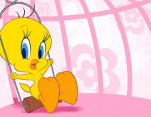 tweety the chicken is sitting on a swing in a pink cage .