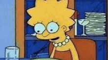 a cartoon character named lisa simpson is sitting at a table with a plate of food in front of her .