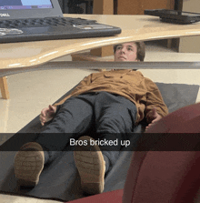 a man laying on the floor with the words " bros bricked up " written on the bottom