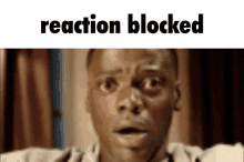 a man with a surprised look on his face and the words reaction blocked above him