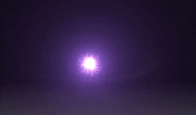 a purple light is shining on a dark purple background .