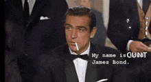 a man in a tuxedo is smoking a cigarette and says his name is james bond .