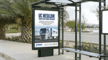 a bus stop with a sign that says uc nesildir on it