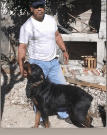 a man standing next to a black dog wearing sunglasses