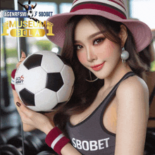 a woman is holding a soccer ball and wearing a sbobet tank top