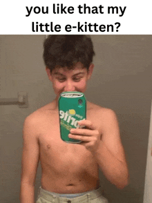 a shirtless young man is taking a selfie with a can of sprite on his chest .