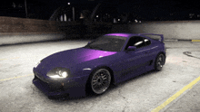 a purple toyota supra is parked in a parking lot