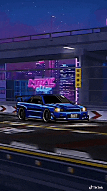 a blue sports car is driving down a street in front of a neon sign that says ntal edge