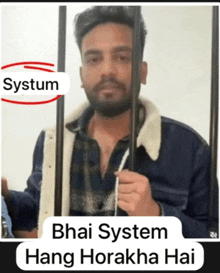 a man behind bars with the words " bhai system hang horakha hai "