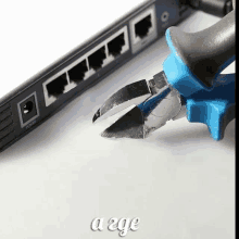 a pair of pliers next to a router with the word a2ge below it