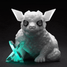 a statue of a rabbit with a crystal in its paw