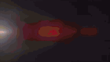 a computer generated image of a red and blue light coming out of a hole