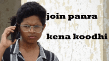 a man with glasses is talking on a cell phone with the words join panra kena koodhi written below him