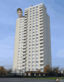 a tall building with a picture of a man on top