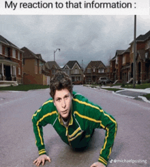 a man in a green and yellow jacket is doing push ups on the ground