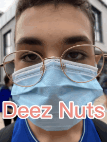 a person wearing glasses and a face mask with the words deez nuts written below them