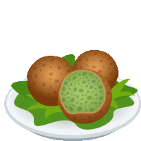 a cartoon illustration of falafel on a plate with green leaves