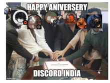 a group of people gathered around a cake that says discord india