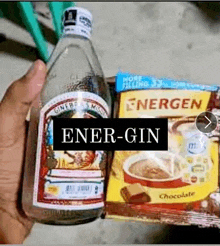 a person is holding a bottle of ener-gin next to a package of energen chocolate