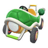 a green and yellow turtle shaped toy car with a cannon attached to the back