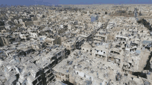 an aerial view of a destroyed city with many buildings