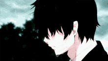 a boy with black hair is standing in the rain