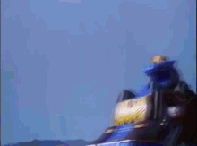 a blurry picture of a person riding a motorcycle with a lightning bolt