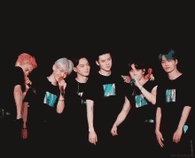 a group of young men are posing for a picture together