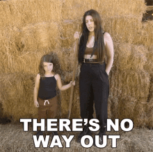 a woman and a little girl are standing in front of hay bales with the words " there 's no way out " above them