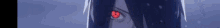 a close up of a person 's eye with a red pupil in the dark .