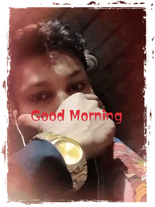 a man wearing headphones and a watch with the words good morning on the bottom