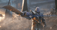 thanos is holding a giant sword in a battle scene