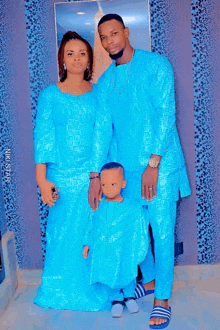 a family posing for a picture with niki star written on the bottom right