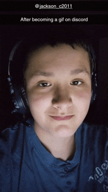 a boy wearing headphones is taking a selfie with a caption that says " after becoming a gif on discord "