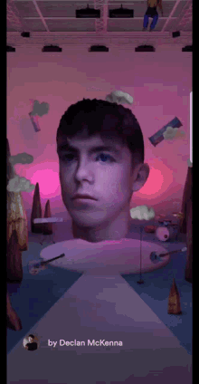 an animated image of a man 's head with the words by declan mckenna below it