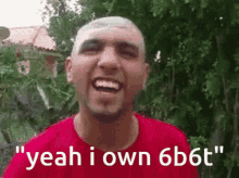 a man in a red shirt says " yeah i own 6b6t " in front of trees