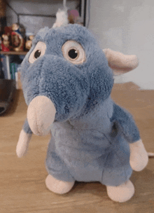 a stuffed animal that looks like a rat with a big nose