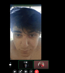 a man without a shirt is on a video call with another man