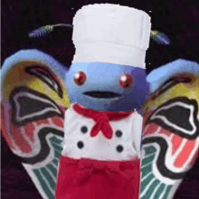 a blue butterfly with a chef 's hat and apron