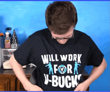 a man wearing a t-shirt that says will work for j-bucks