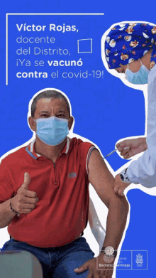 a man wearing a mask is getting a vaccine from a doctor