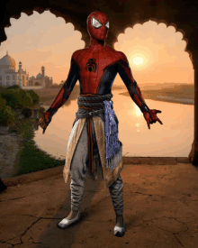 a man in a spiderman costume is standing in front of a body of water