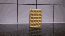 a waffle is sitting on top of a black counter